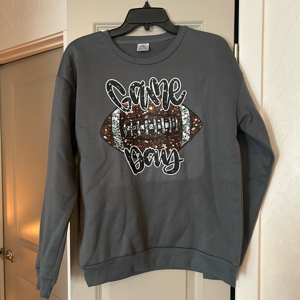 (3) themed crewneck sweatshirts